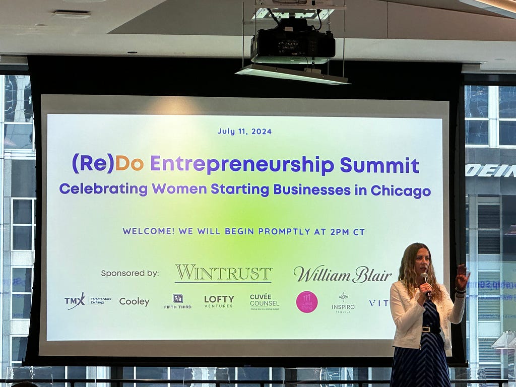 Gale Wilkinson kicks off the (Re)Do Entrepreneurship Summit on stage.