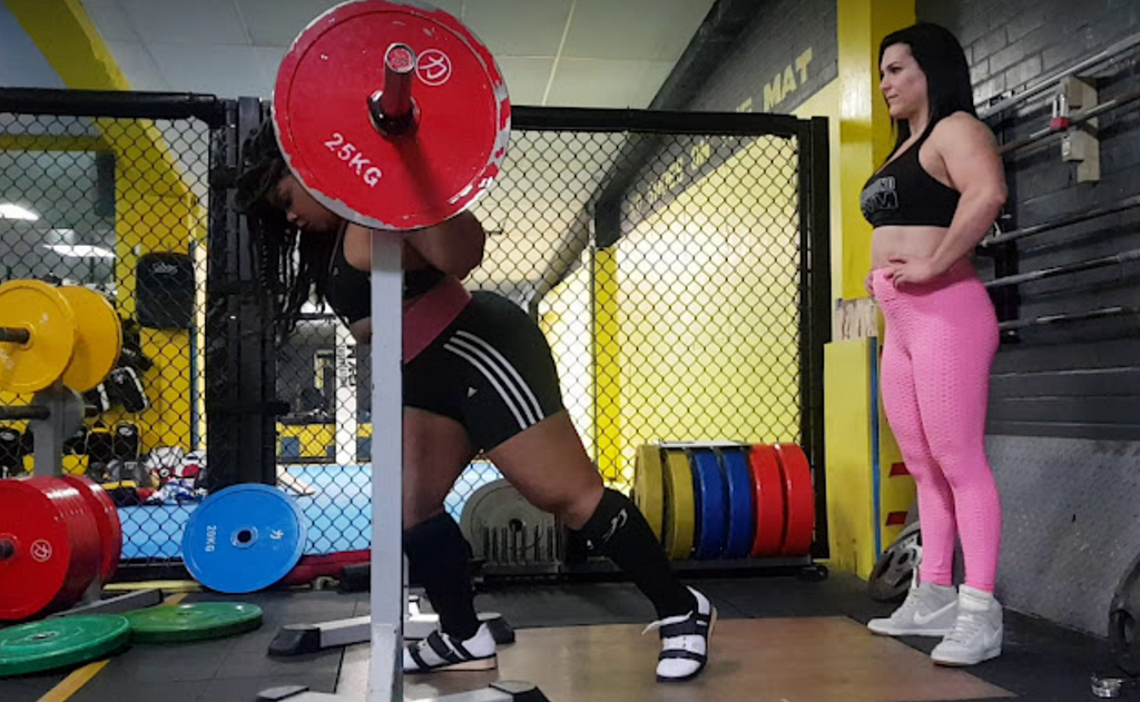 Johana setting up for a 95KGs Squat in training — Underground Gym Brighton