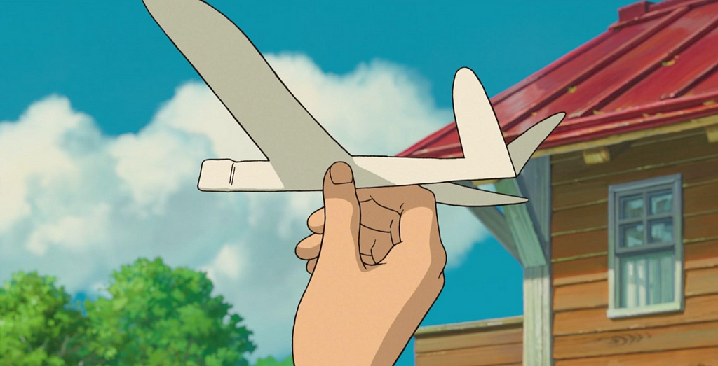 An animated hand holding a paper aeroplane, poised to throw it into the air.