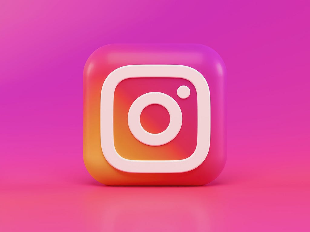 A 3D redesign of the Instagram logo, on a bright pink background