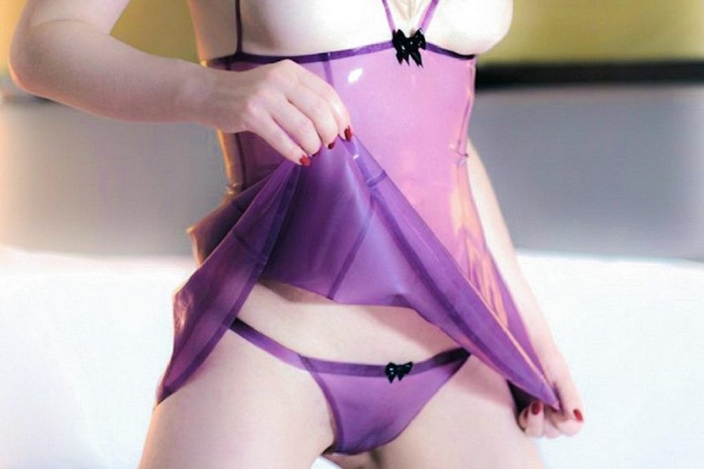 Woman in purple sexy latex lingerie