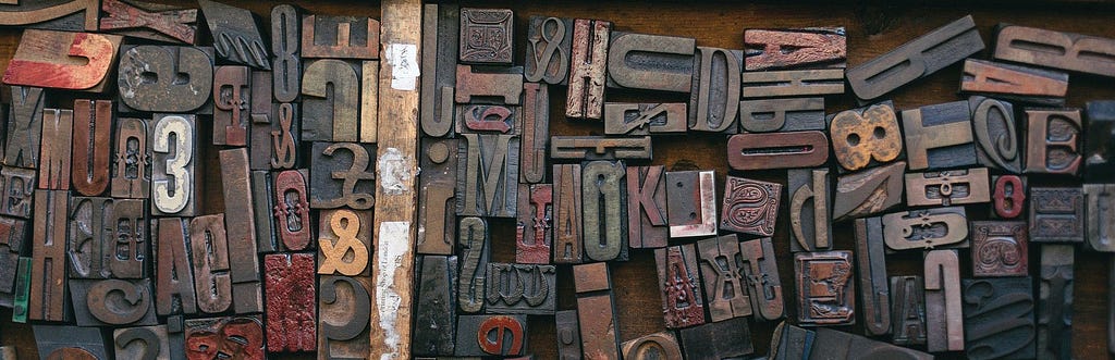 A collection of antique wood letter blocks