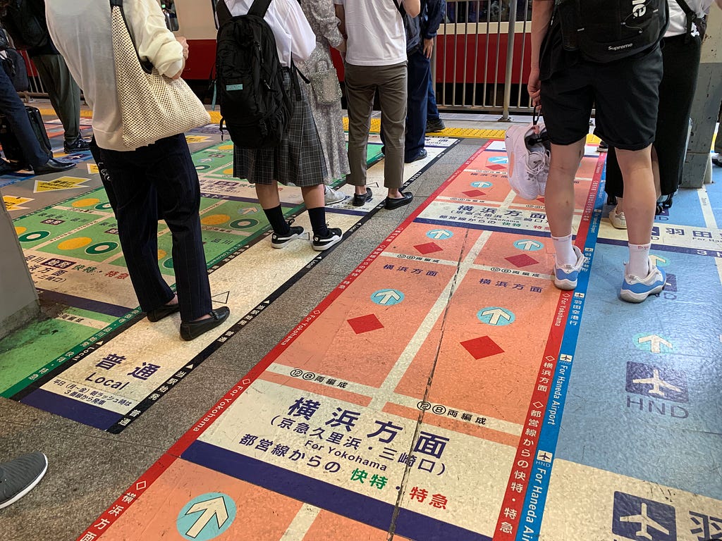 People lined up on the subway platform in Tokyo