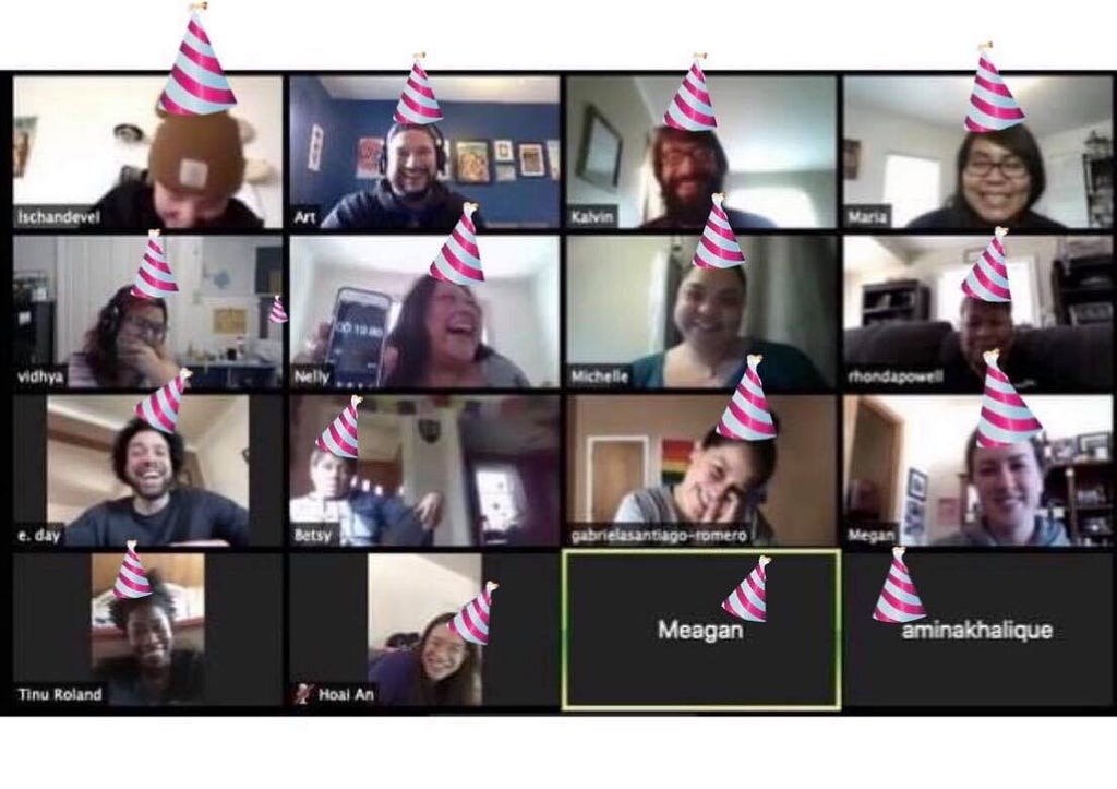 Screenshot of zoom call with people laughing and smiling, with photoshopped pink stripped birthday hats on everyone’s heads.