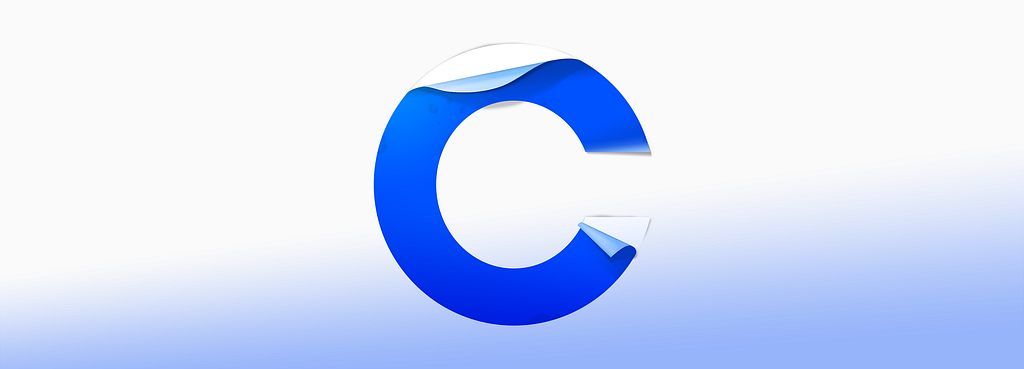 A peeling blue sticker in the shape of the letter C.