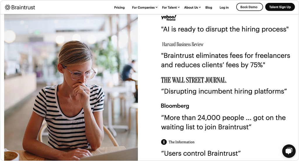 A screenshot of the Braintrust website featuring a photo on the left of a woman in glasses and a striped shirt working on a laptop in a café-like setting with a blurred background. On the right, quotes from notable publications highlight Braintrust’s impact, including its disruption of hiring processes, cost reduction for freelancers and clients, user control of the platform, and its popularity with over 24,000 people on a waiting list.