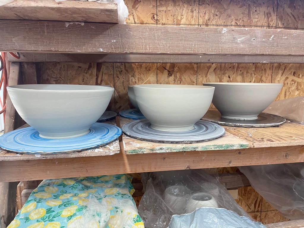Ceramics drying on the shelf