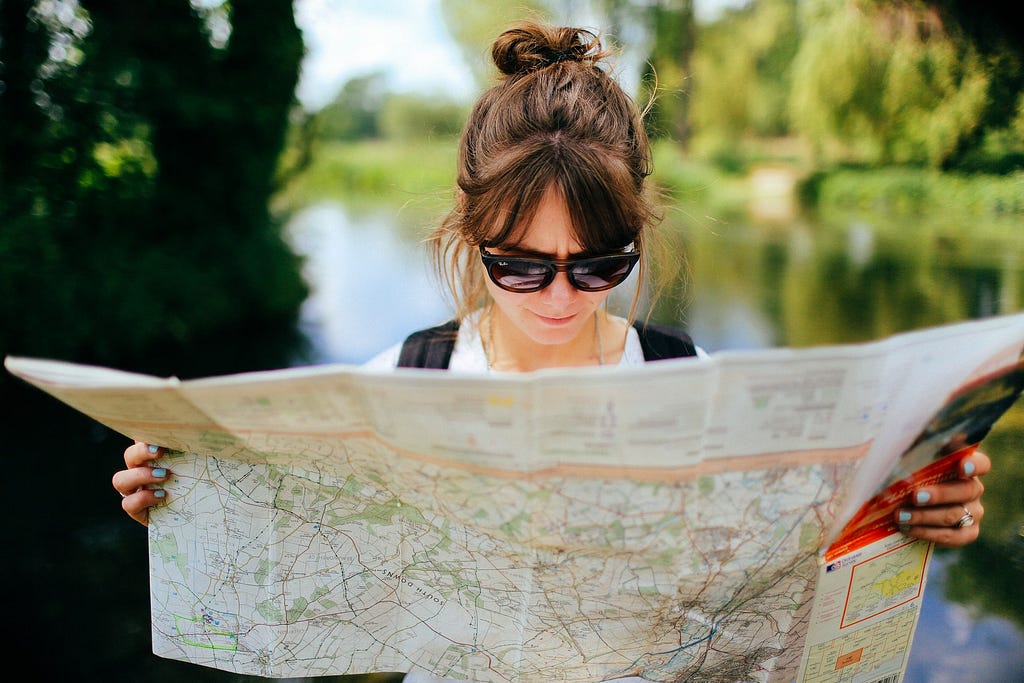 A woman looking at a map