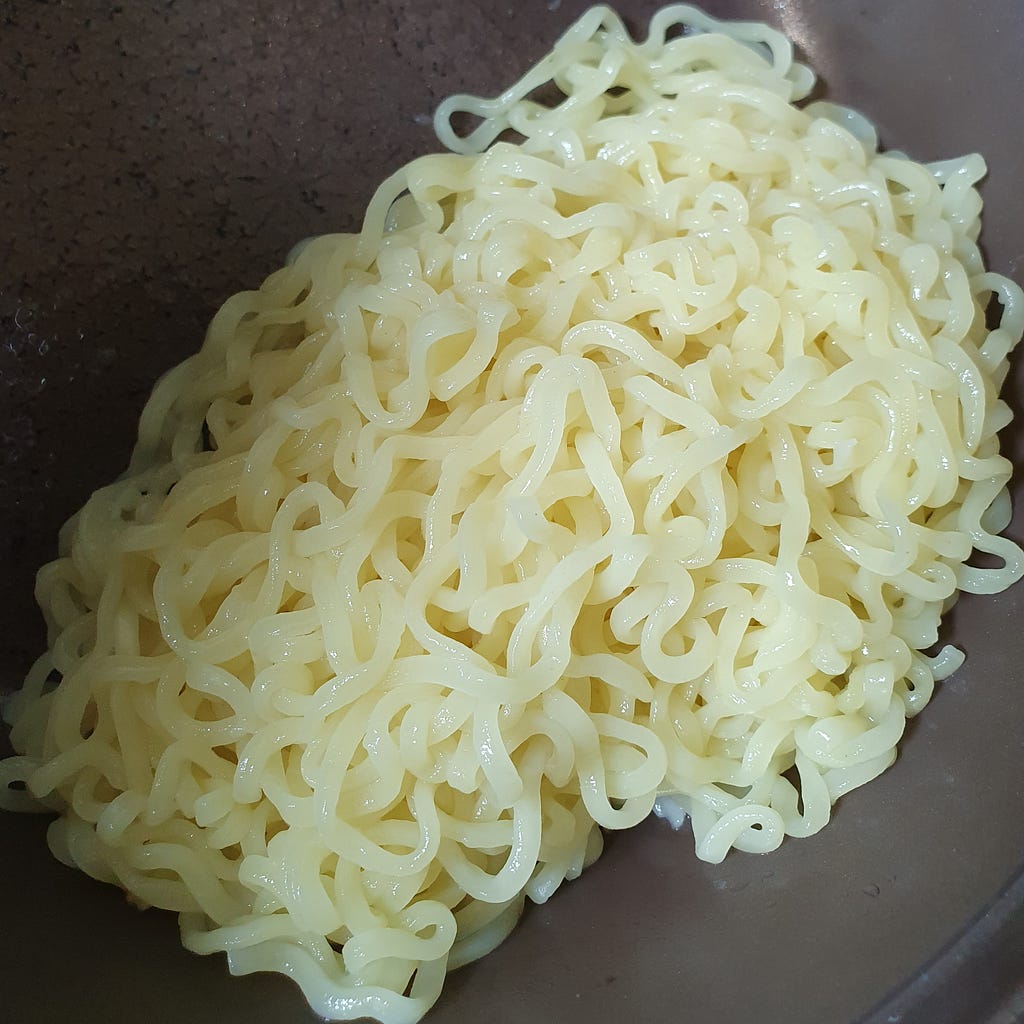 Noodles rinsed with cold water for a package of Wicked Ramen (Yogoe Ramyeon) Shinsadong Naengcho-Myeon Flavor.