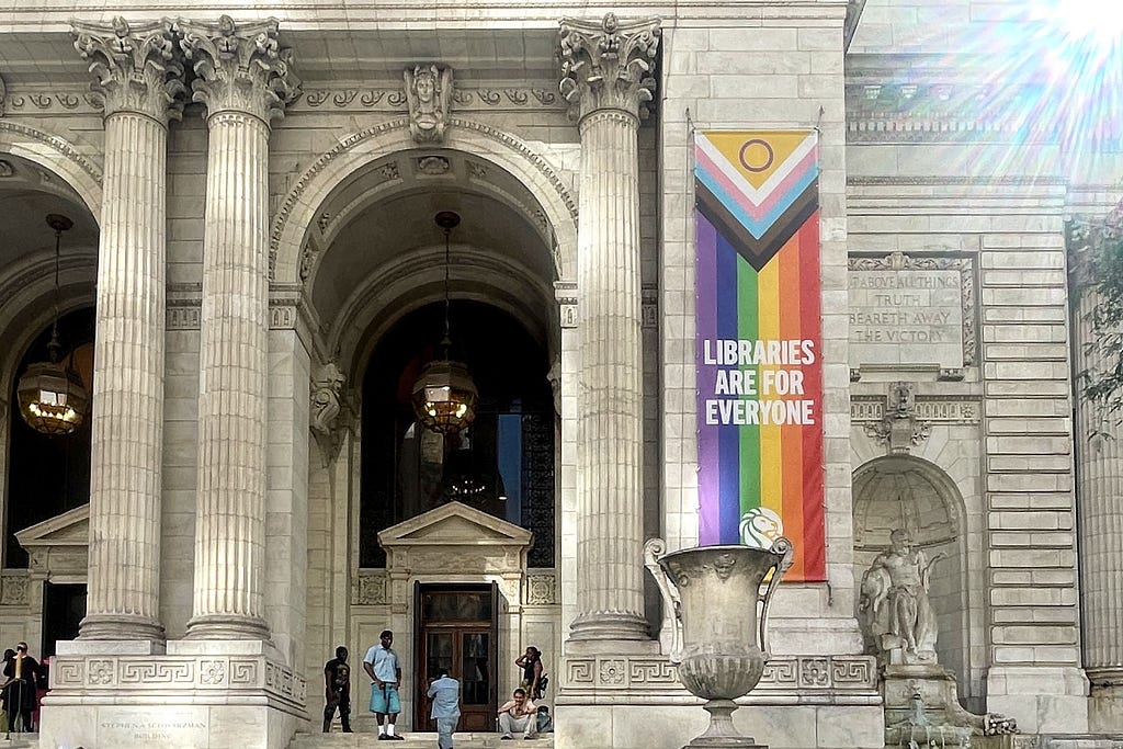 pride flag reads Libraries are for Everyone