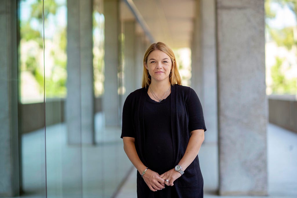 Miquelle McCarthy, a social work major, standing in front of the Student Services Building at Cal State LA.