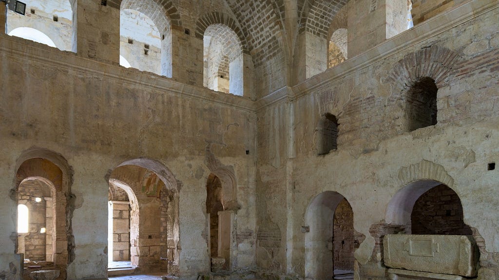 The interior of a sixth century Byzantine/Roman Empire cathedral with arched windows and much light.