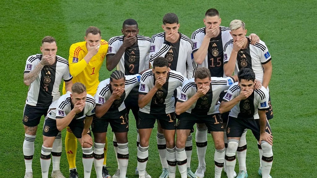 photo of German team covering their mouths in protest