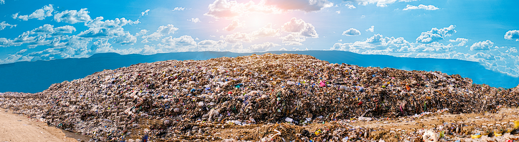 Literal piles of trash represent our consumerism