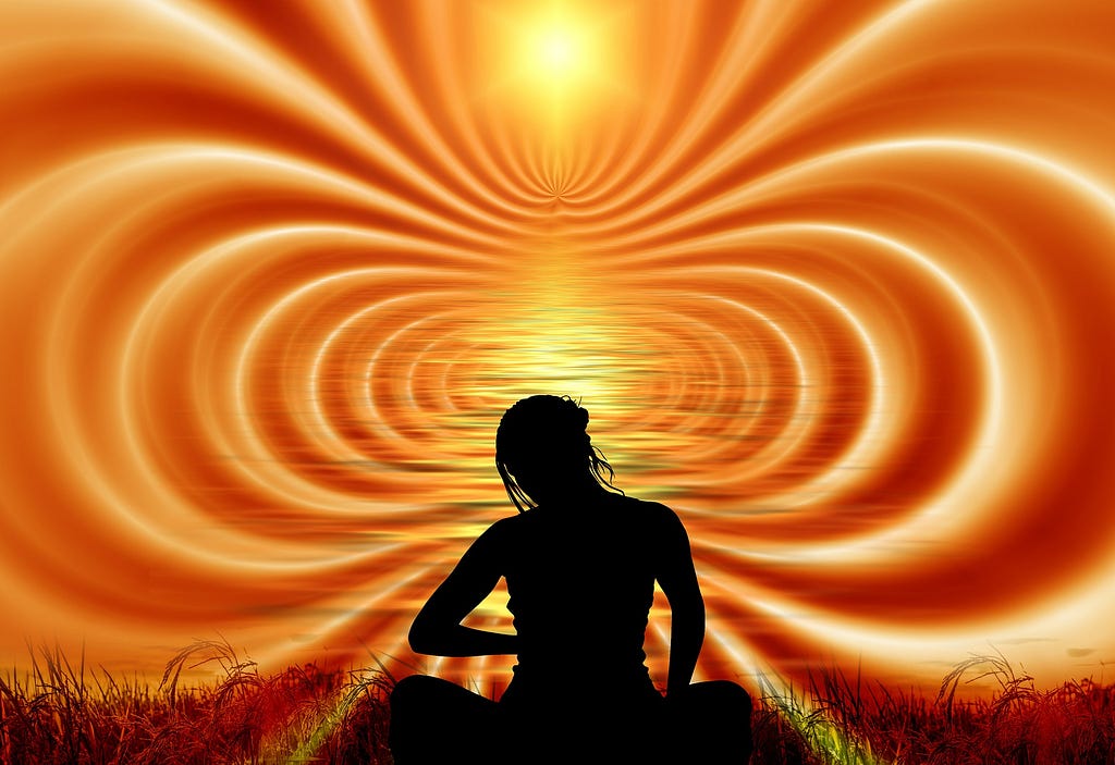 yellow and red waves of energy flow out from woman’s silhouette