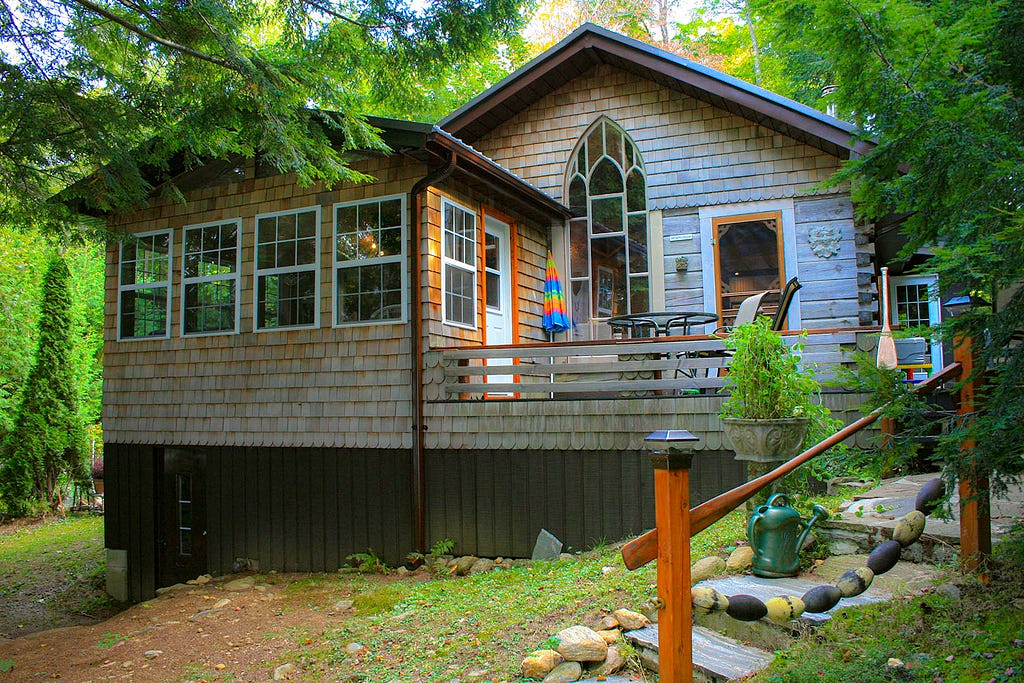 A log home pictured in summer