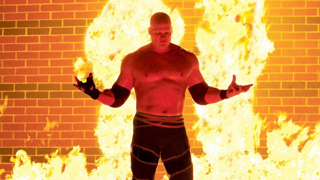 Kane in front of fire.