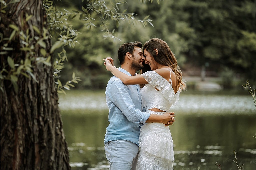 A joyful couple embracing each other, showcasing the warmth and connection in their successful marriage.