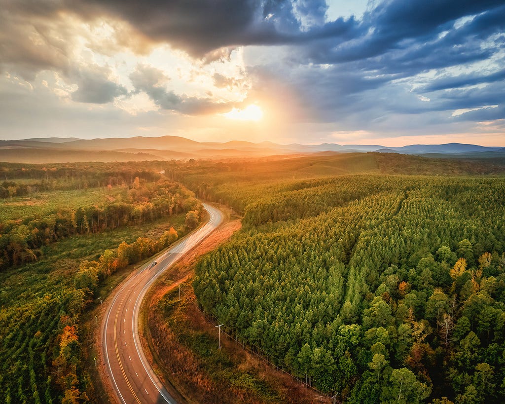 Arkansas Highway 10 snakes its way westward to edge of the Ouachitas, through farmland, pine farms, and deciduous forest.