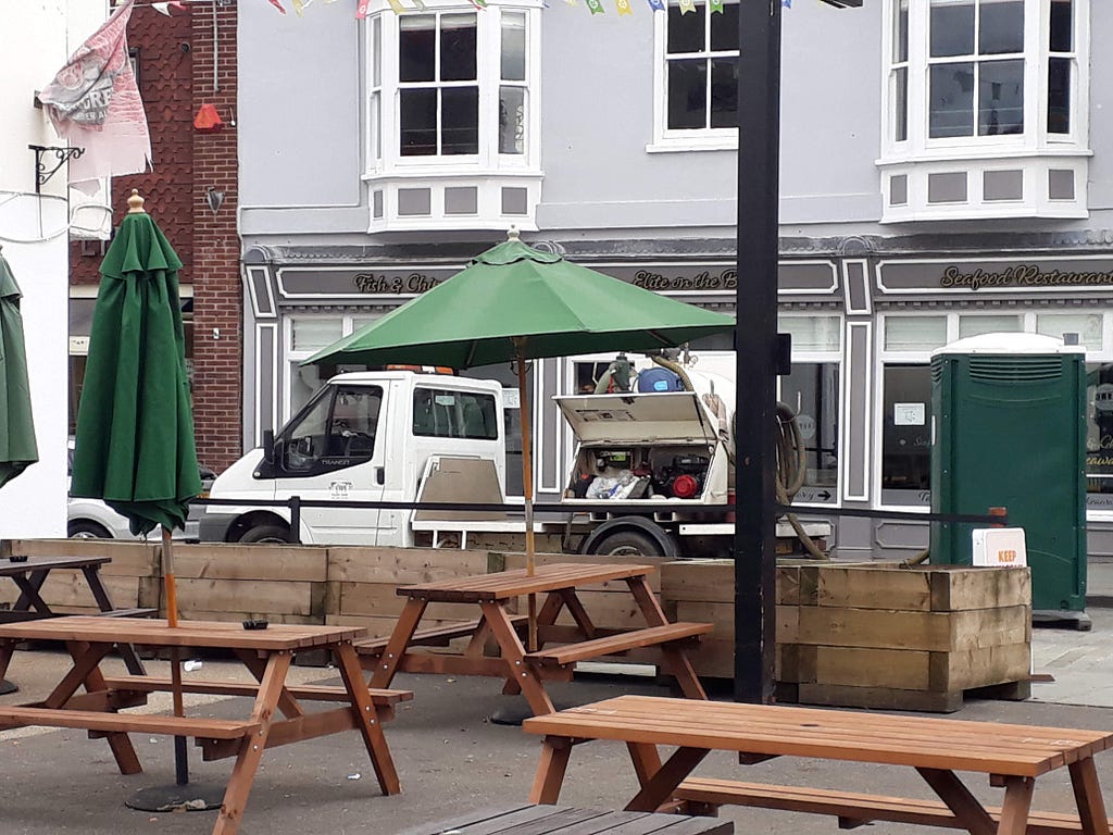 The Lion and Snake toilets dragged past drinkers emptied in the street