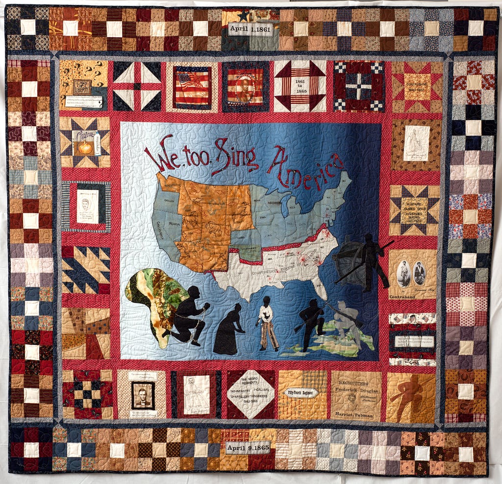 A colorful quilt depicting the United States and several Black figures. The lettering on the quilt reads “We too Sing America.”