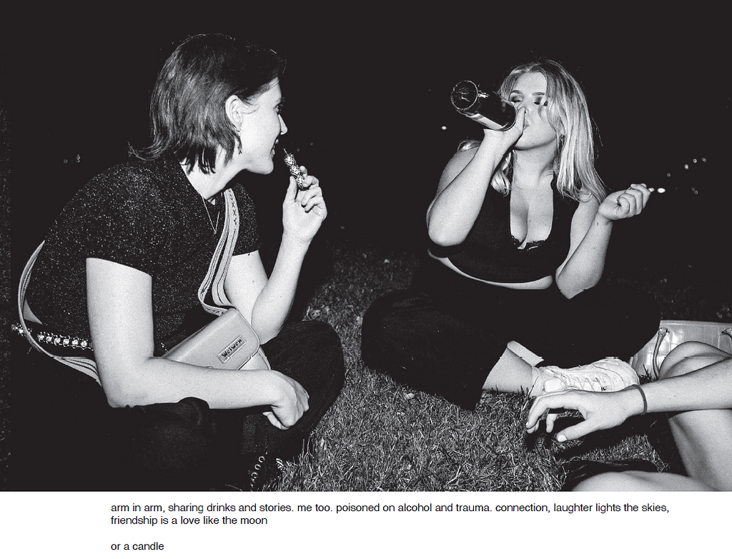 A pair of young women having a late night chat and drink, sitting in the park.