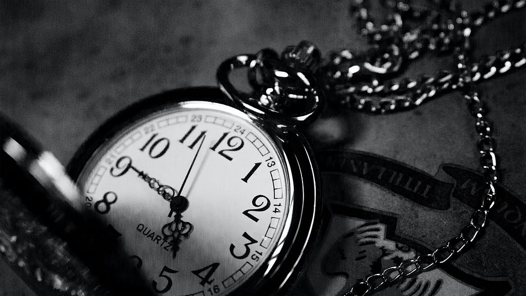 Close-up of the face of an antique pocket watch.