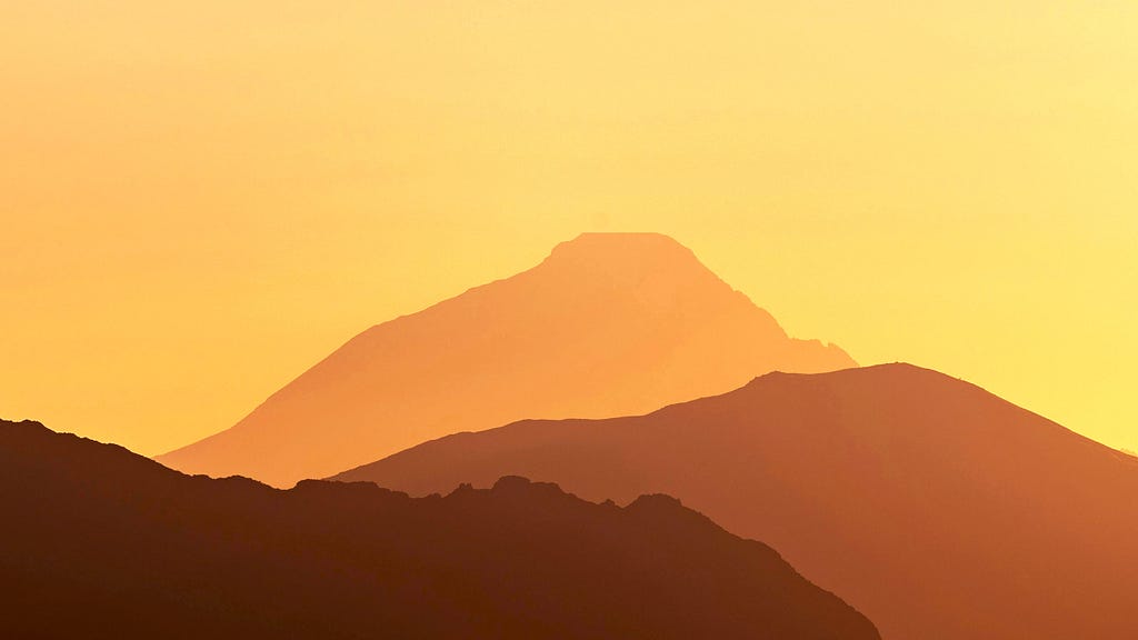 Desert mountains in silhouette.