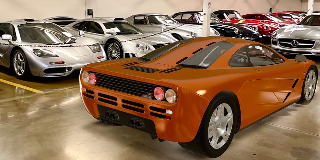 A digital orange McLaren F1 in a physical garage of super cars including a silver McLaren F1 and Mercedes CLK GTR
