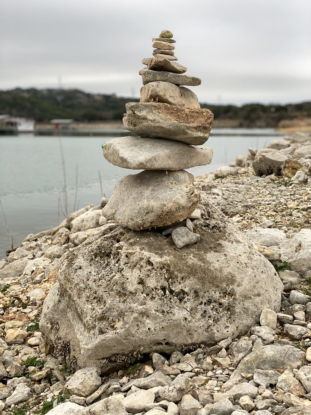 Rocks balanced along the shore of Lake Travis