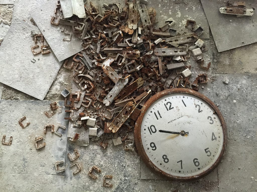 Old Clock on Floor at Pripyat Ghost City — Photo by Henry Nicholson