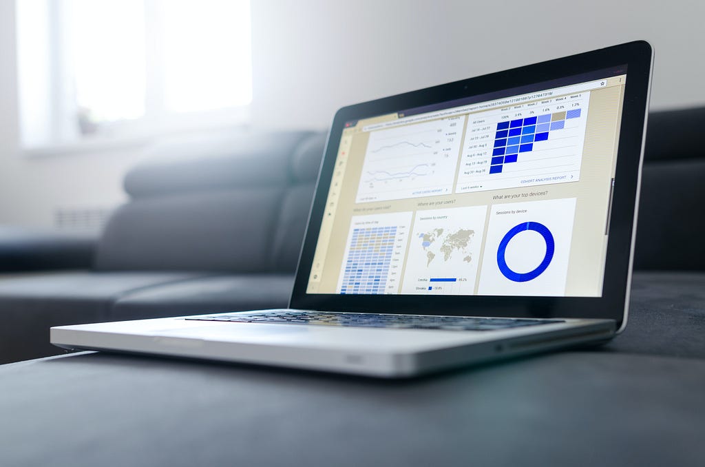 Laptop screen showing graphs and numbers