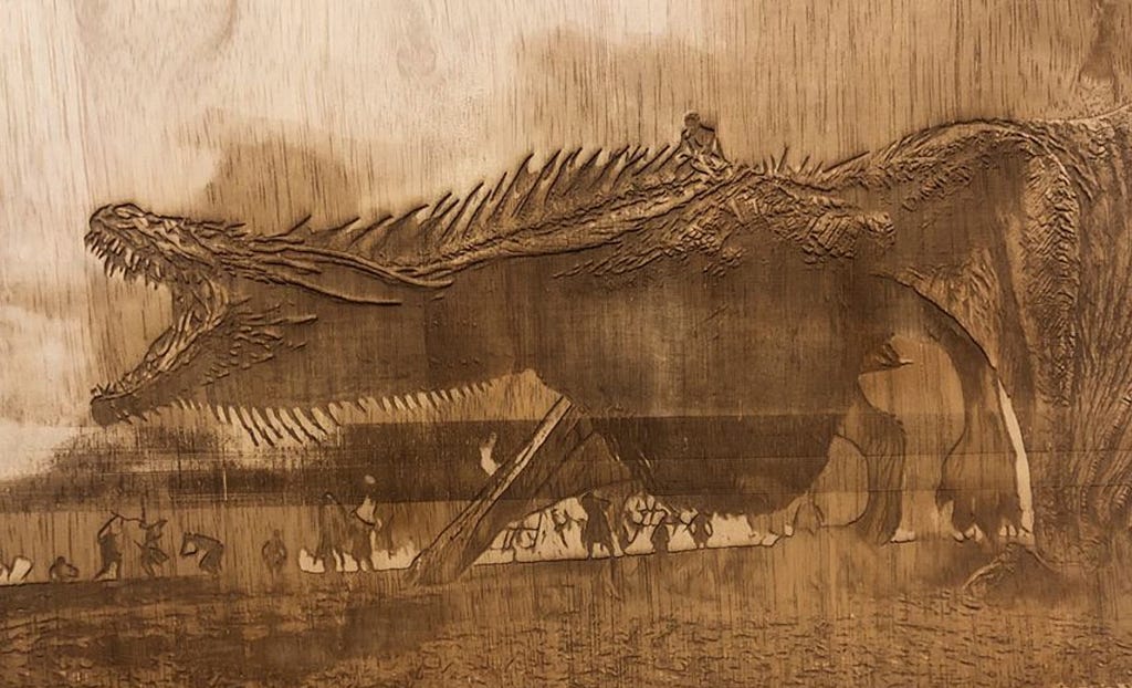 Image of an artwork created by Hari using laser etching on wood.