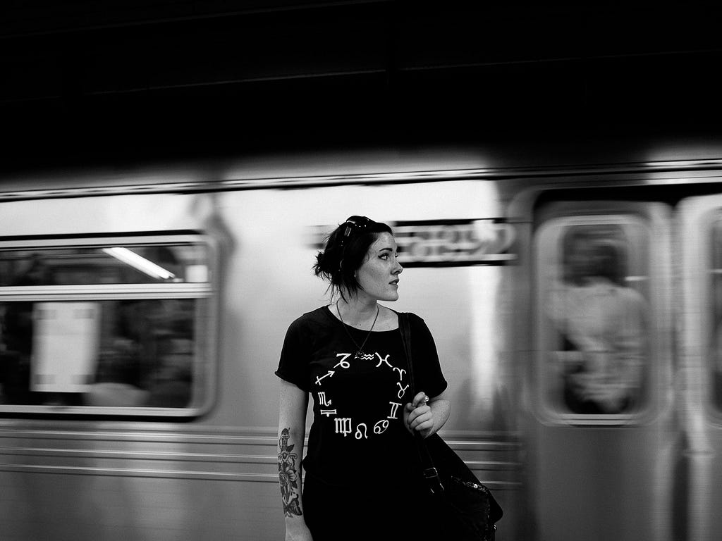 A woman with a passing train on her back