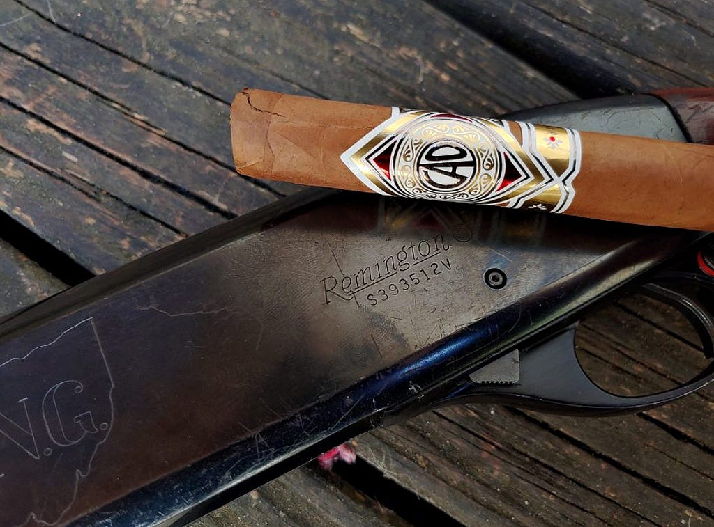 CAO Gold cigar and Remington 870 ONG
