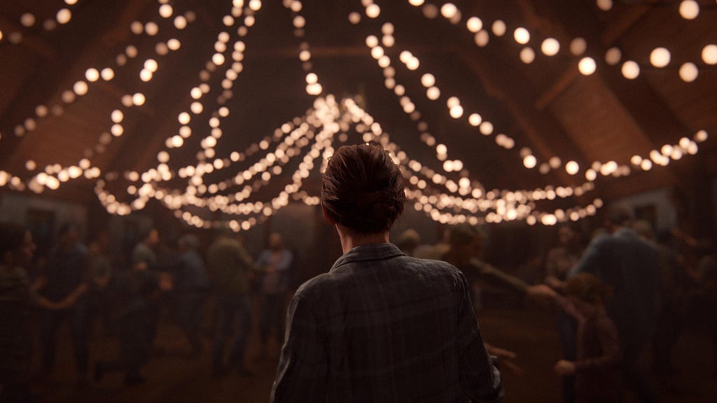 Ellie with her back to the camera, looking onto a party in a room filled with fairy lights.