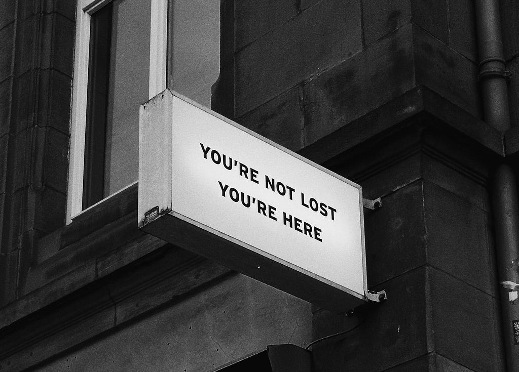 Sign that says “You’re not lost, you’re here”