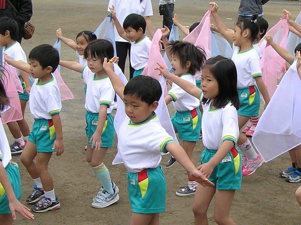 Japanese children performing on sports day while at school