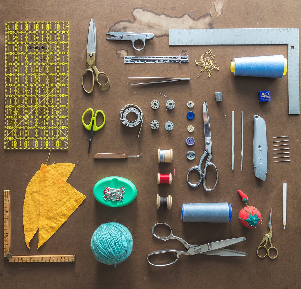 Sewing tools laid out on a table.