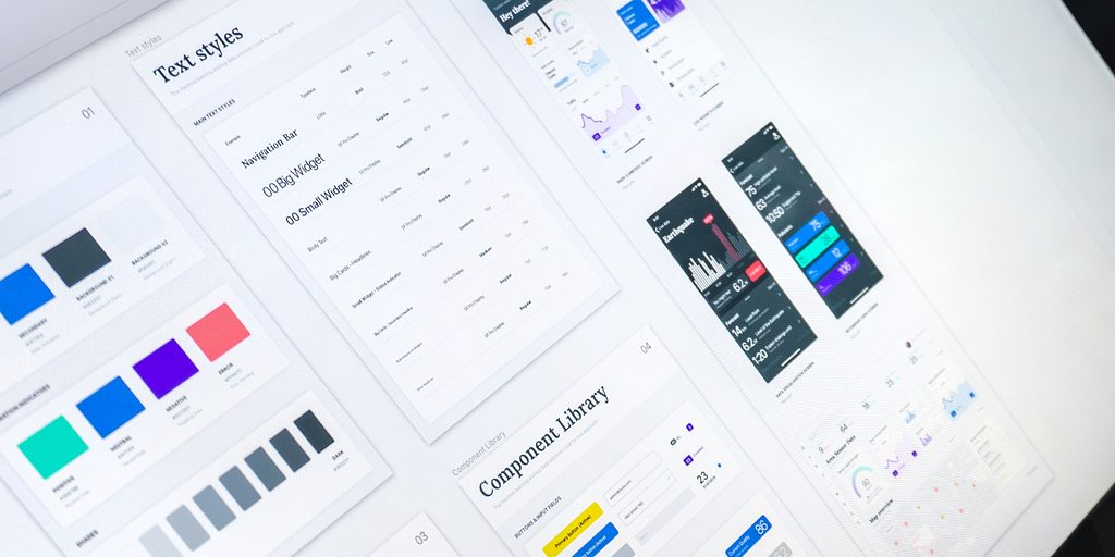 Angled close-up of a UX designer’s computer screen showing design system in use.