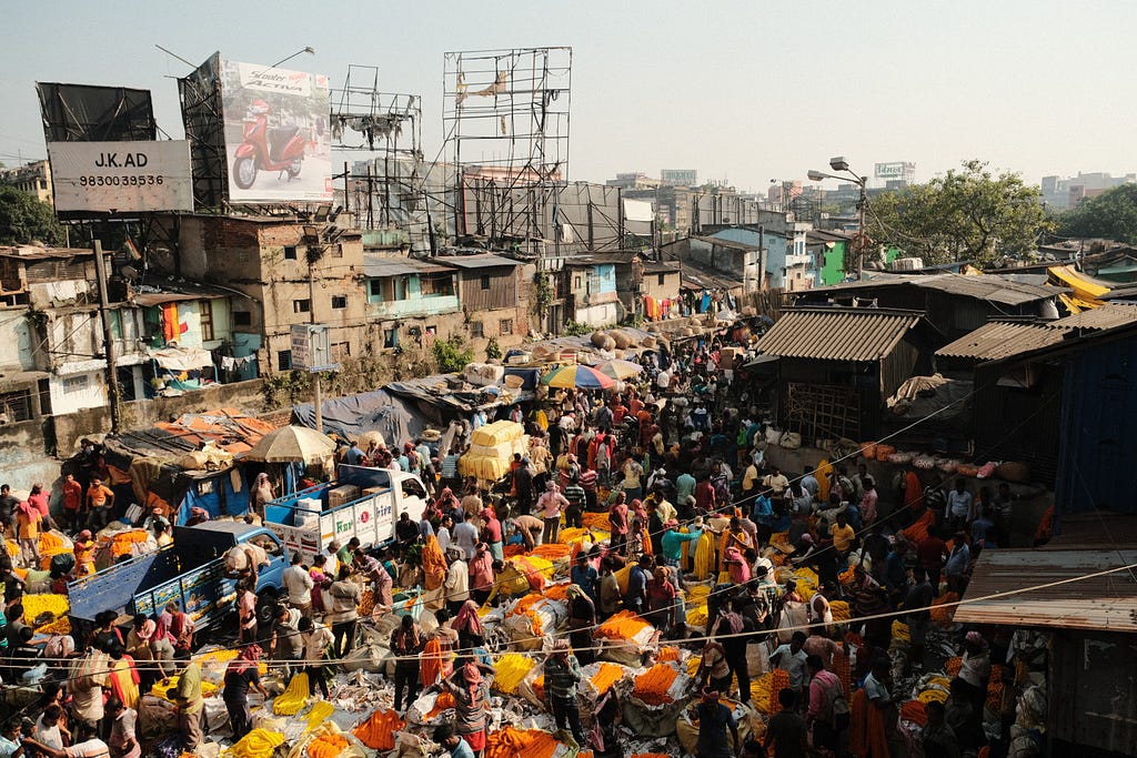 Overview of Indian people in a crowded settlement