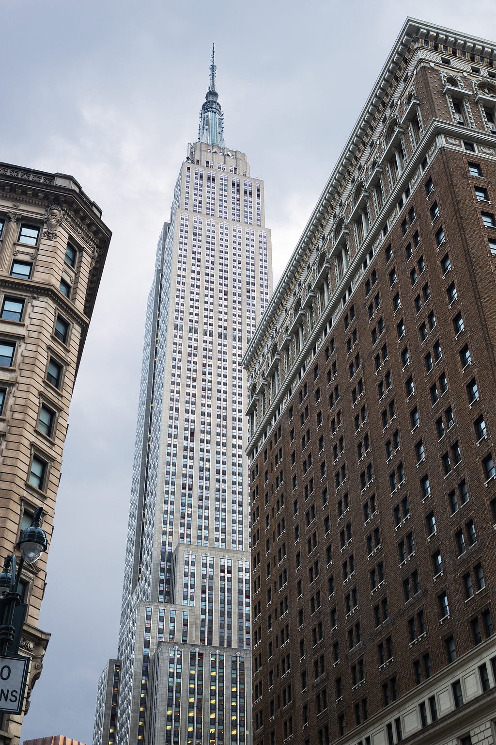 Image of the Empire State Building, image credit Adobe Stock. https://stock.adobe.com/images/view-looking-up-of-the-empire-state-building-seen-from-herald-square-new-york-city-united-states/280146426?prev_url=detail&asset_id=280146426