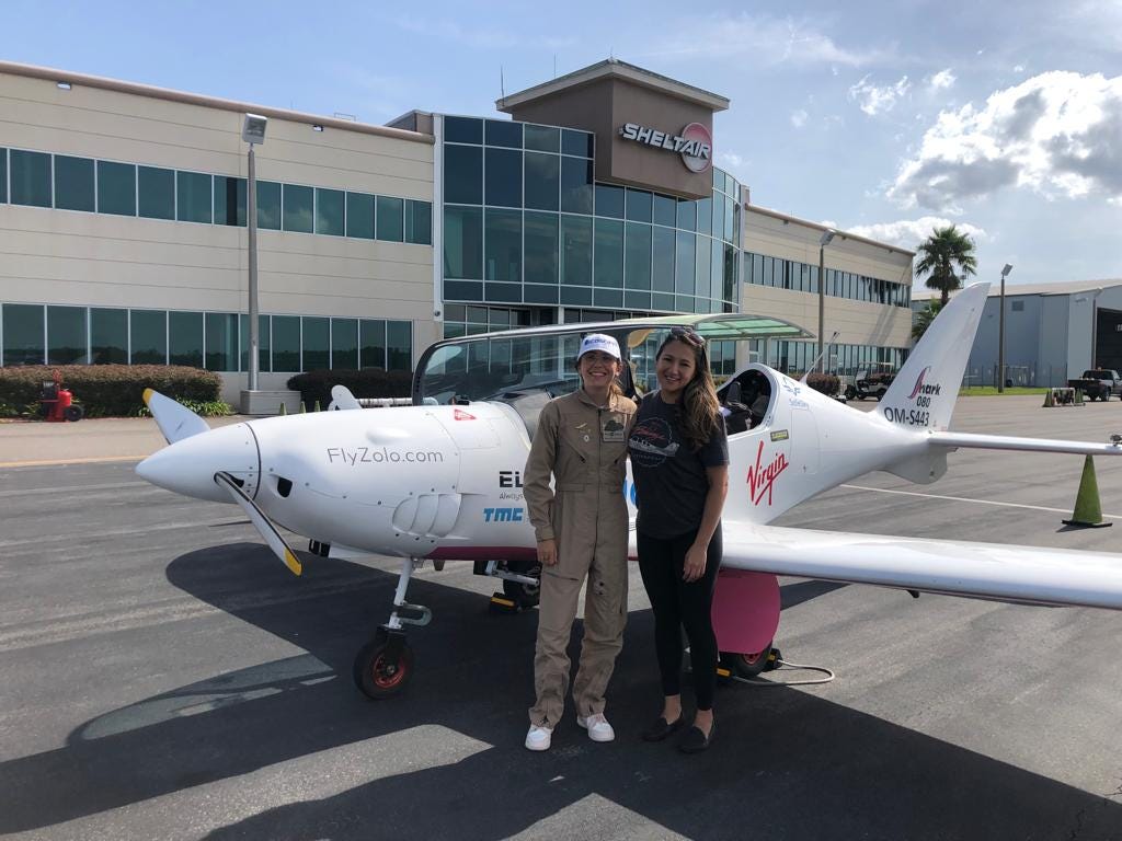 Zara and Shaesta posing in front of Zara’s glider at the Jacksonville airport.