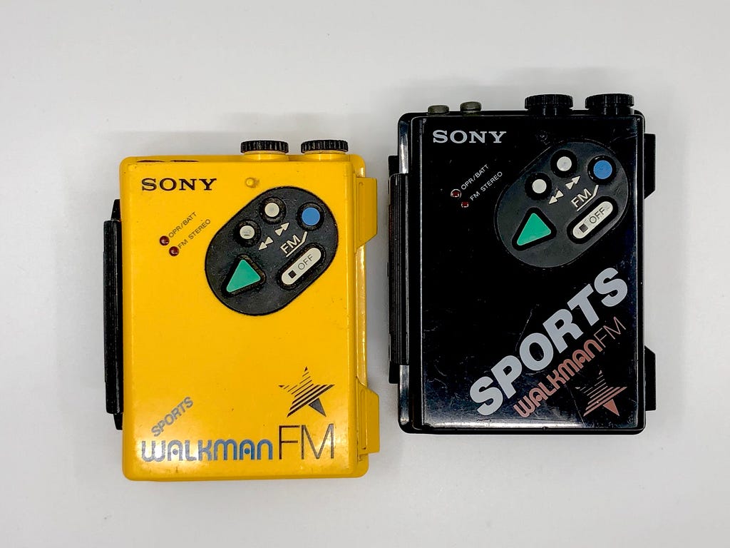 Yellow and black Sony Sports Walkman shown side by side.
