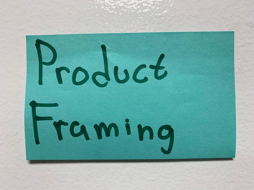 Photo of a sticky note that reads “Product Framing”