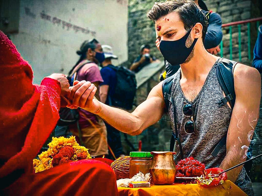 Receiving a tika and doroo at Dakshinkali Temple, Nepal. Photo by Rajesh Khadka.