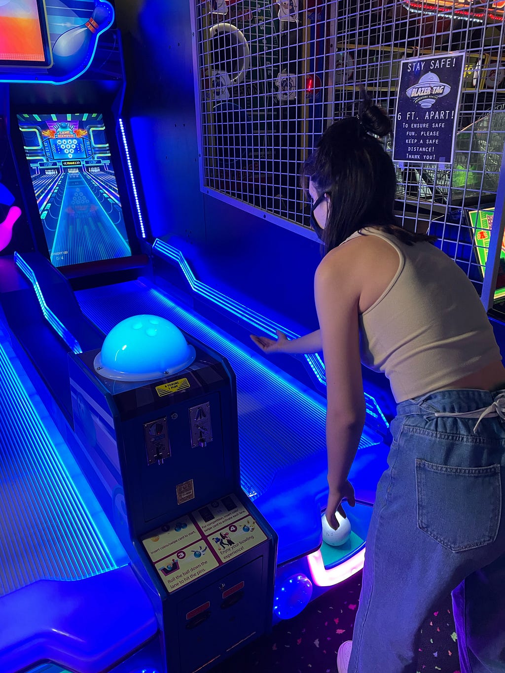 My partner playing skee-ball