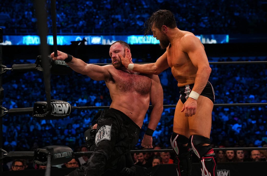 Bryan Danielson slapping Jon Moxley. AEW Revolution, March 6.