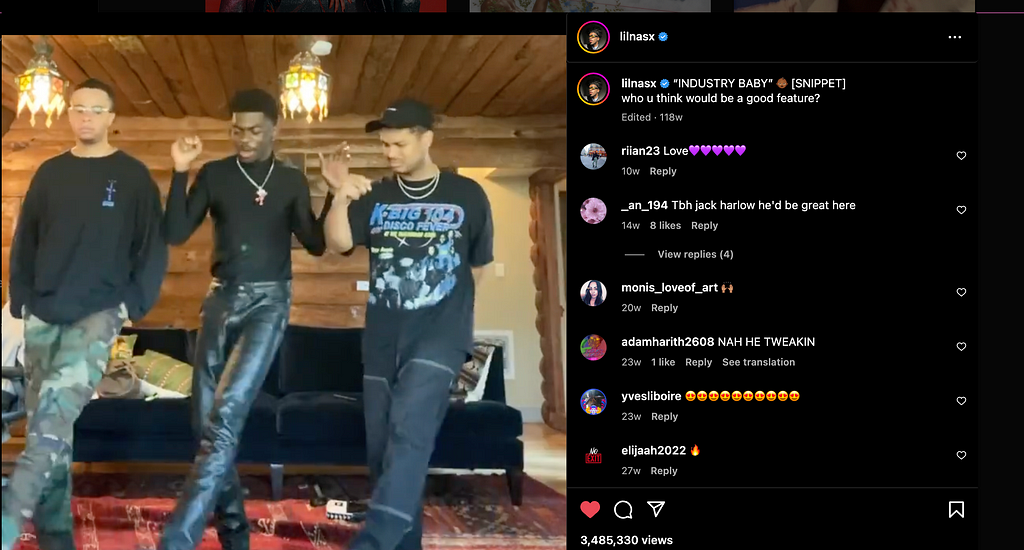 Lil Nas x and two of his friends dancing to a promo if his soong in front of a black couch