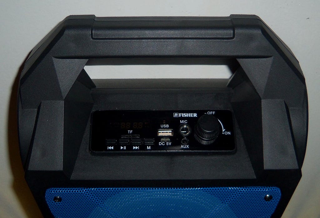 Closeup of the speaker’s buttons and ports